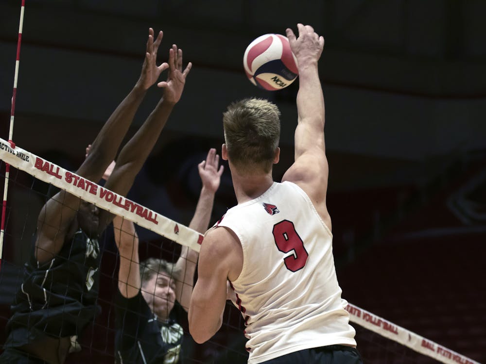 Fourth-year outside hitter Bryce Behrendt hits the ball over the net in a game against Quincy March 24 at Worthen Arena. Behrendt had seven digs in the game. Mya Cataline, DN