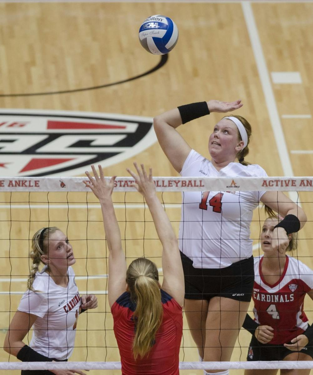 Fifth year senior middle blocker Kelly Hopkins attempts to hit the ball over the net in the second game of the Active Ankle Tournament against Belmont on Aug. 28 at Worthen Arena. DN PHOTO BREANNA DAUGHERTY