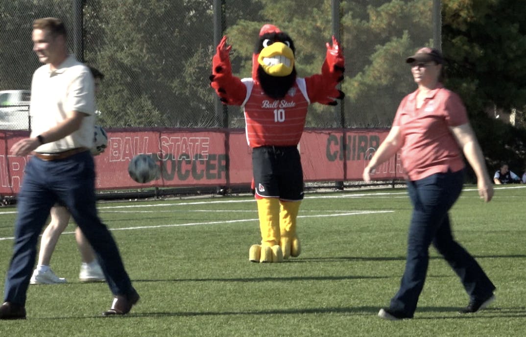 Charlie Cardinal cheers on professors at Professors on the Pitch event.