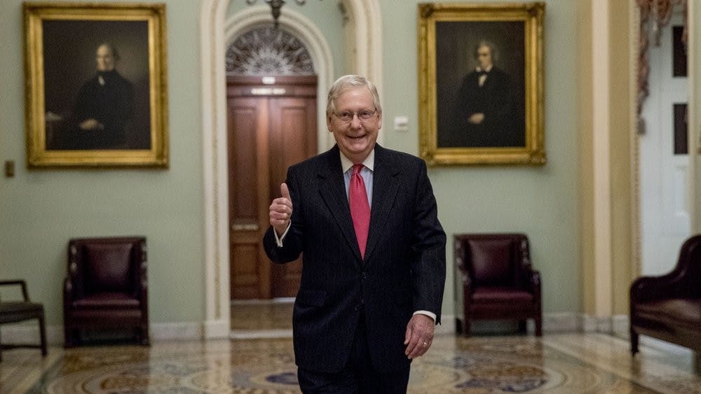 Senate Majority Leader Mitch McConnell of Ky. gives a thumbs up as he arrives on Capitol Hill, Wednesday, March 25, 2020, in Washington. (AP Photo/Andrew Harnik)