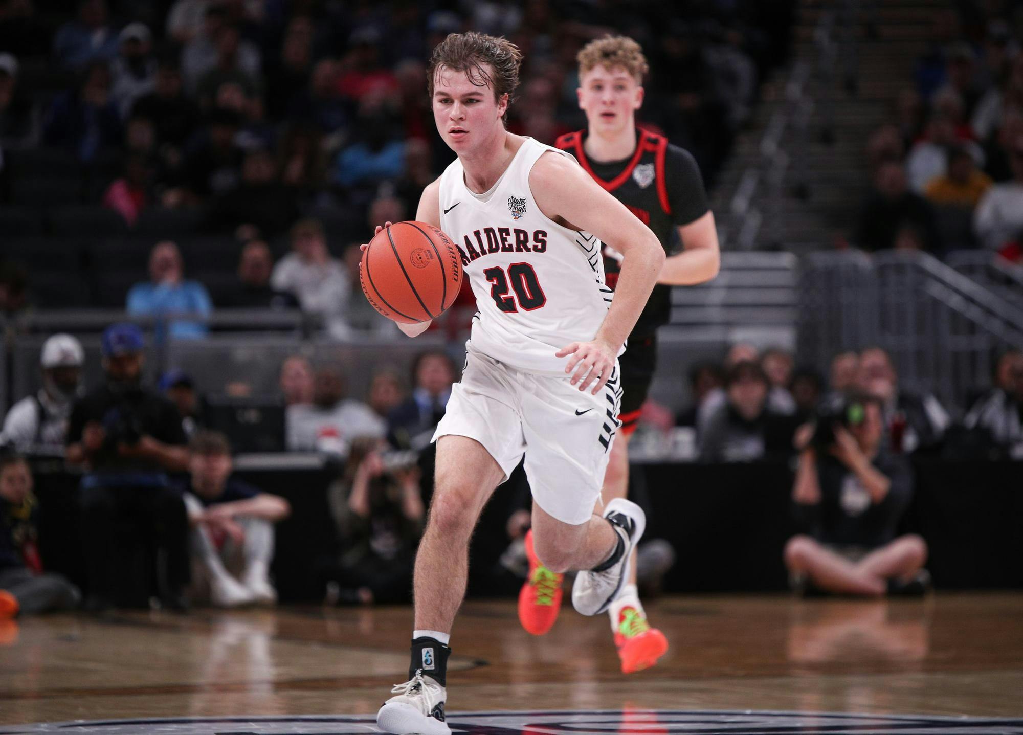 Guard Isaac Andrews dribbles the ball against Brownstown Central March 30 at Gainbridge Fieldhouse. Andrew Berger, DN 