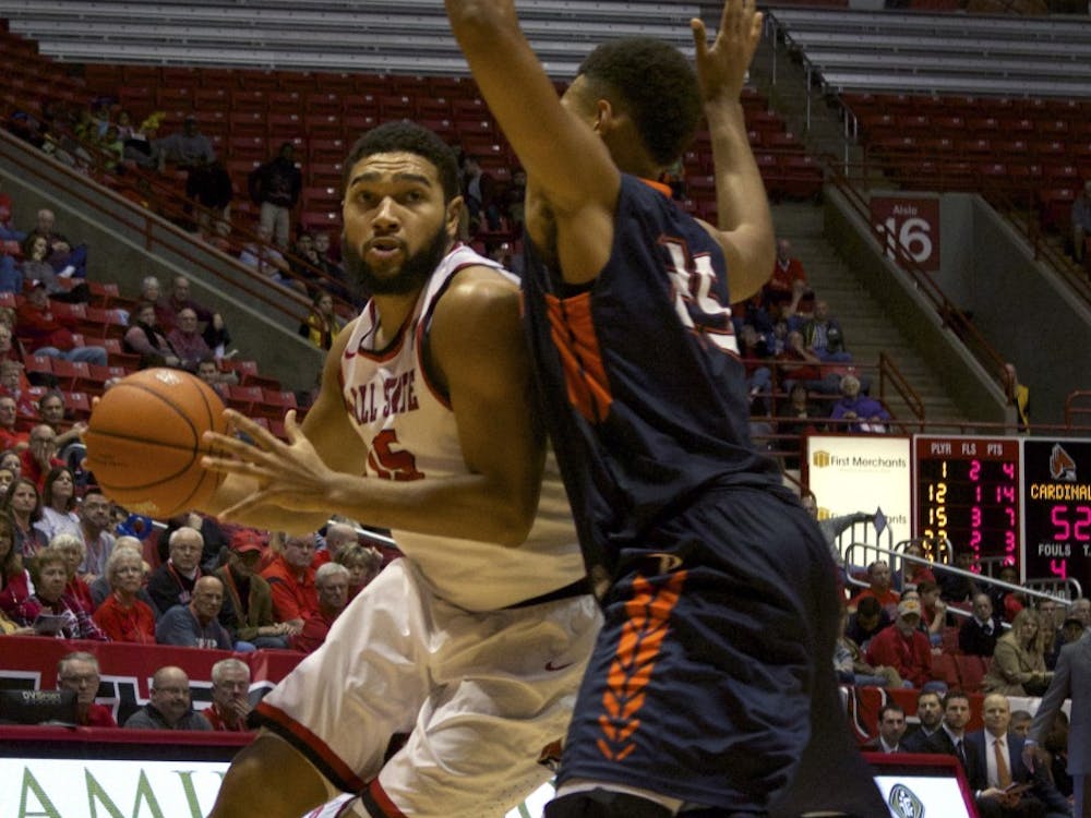 Ball State’s junior forward Franko House attempts to push past Pepperdine’s defense on Dec. 12 in Worthen Arena. DN PHOTO GRACE RAMEY