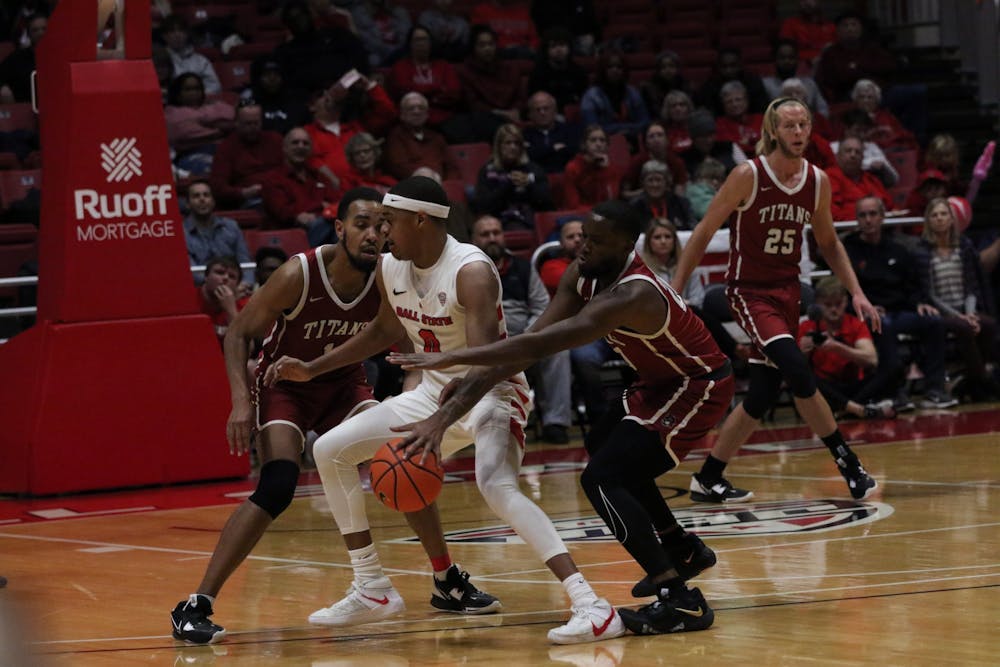 Redshirt junior guard Jarron Coleman protects the ball in a game against IU-South Bend Nov. 19 at Worthen Arena. The Cardinals won 86-72 against the Titans. Mya Cataline, DN