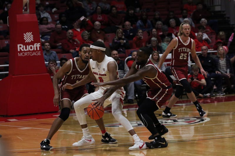 Redshirt junior guard Jarron Coleman protects the ball in a game against IU-South Bend Nov. 19 at Worthen Arena. The Cardinals won 86-72 against the Titans. Mya Cataline, DN
