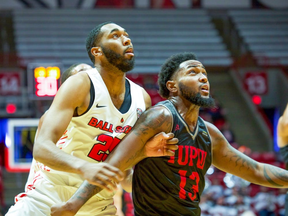 Redshirt Senior Forward, Tahjai Teague (25), looks on in an attempt to grab a rebound over a defender against , IUPUI Dec 7, 2019, in John E. Worthen Arena. The Cardinals beat the Jaguars in a blowout victory 102-54. Omari Smith, DN
