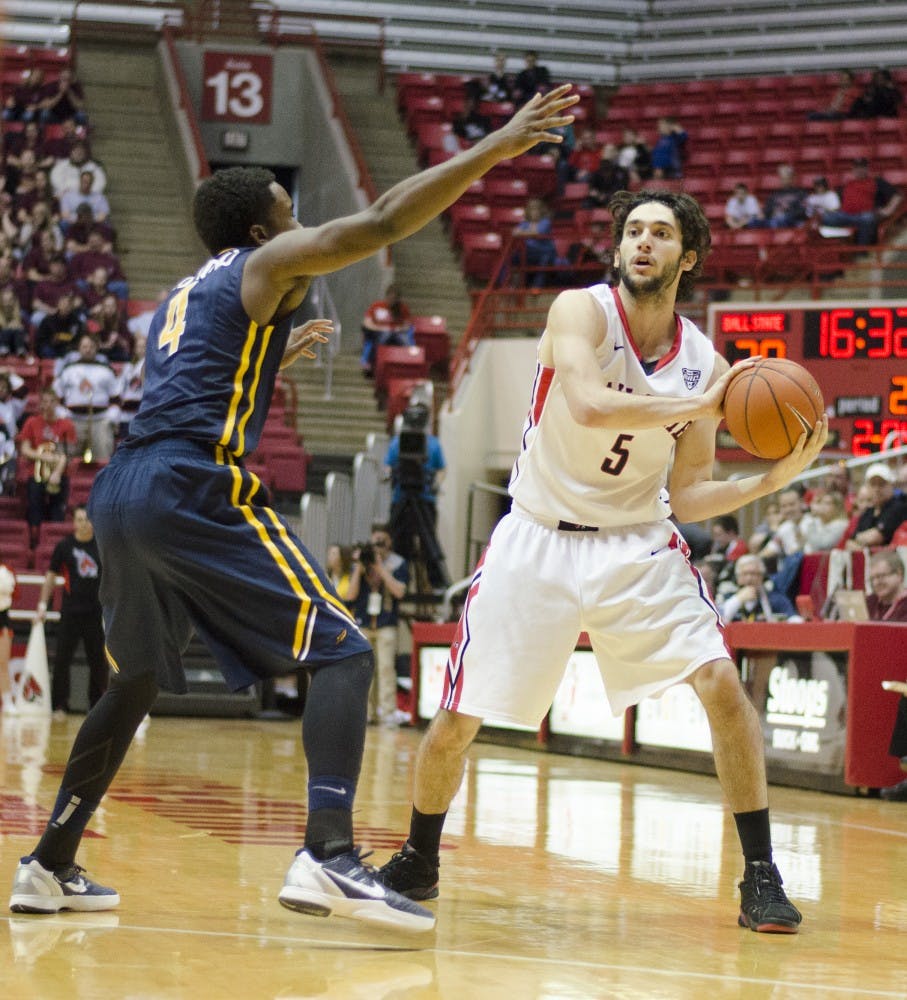 Redshirt sophomore forward Rocco Belcaster looks for an open teammate during the game against Toledo on Feb. 7 at Worthen Arena. DN PHOTO BREANNA DAUGHERTY