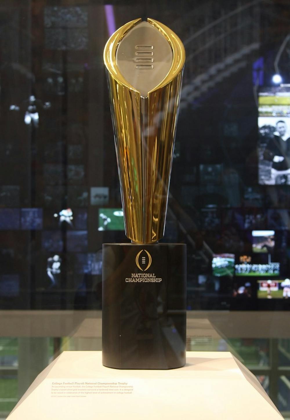 <p>The College Football national championship trophy sits in display at The College Football Hall of Fame in Atlanta, GA Aug. 31, 2017. Alabama has won three national championships since the playoffs started in 2014. <em><strong>Photo Credit: Michael Li, Flickr.</strong></em></p>