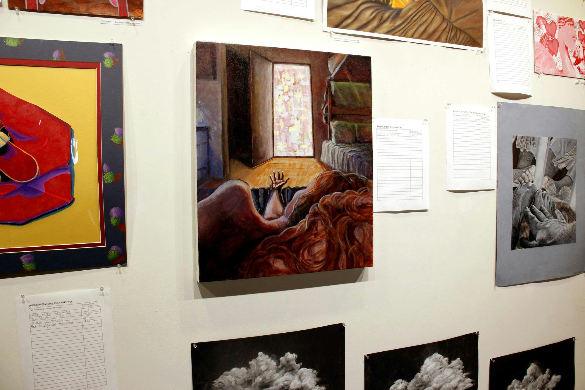 Artwork is displayed during the "Art of Caring" show bidding April 10 in Ball State's Art and Journalism building on Ball State University's campus in Muncie, Ind. Katherine Hill, DN