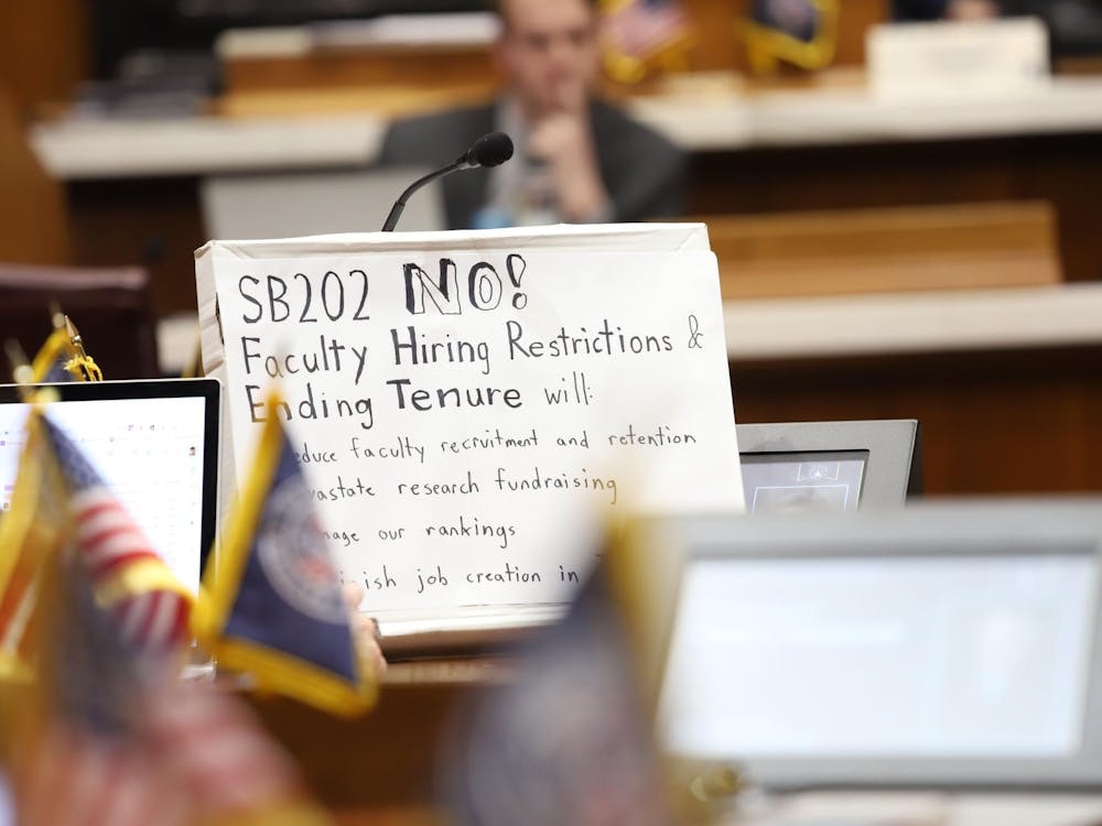 A sign taped to a box sits in the Indiana House Chamber during a House Education Committee Meeting Feb.14 in Indianapolis. Individuals shared testimonies opposing Indiana Senate Bill 202. Olivia Ground, DN