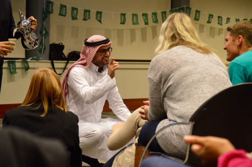 <p>Fahad Aseery,&nbsp;a graduate student studying special education,&nbsp;speaks to students about Saudi Arabian practices on Nov. 23&nbsp;at A Night in Saudi Arabia.&nbsp;More than 100 students and families got together&nbsp;celebrate and learn Saudi Arabian Culture.&nbsp;<i style="background-color: initial;">DN PHOTO REBECCA KIZER</i></p>