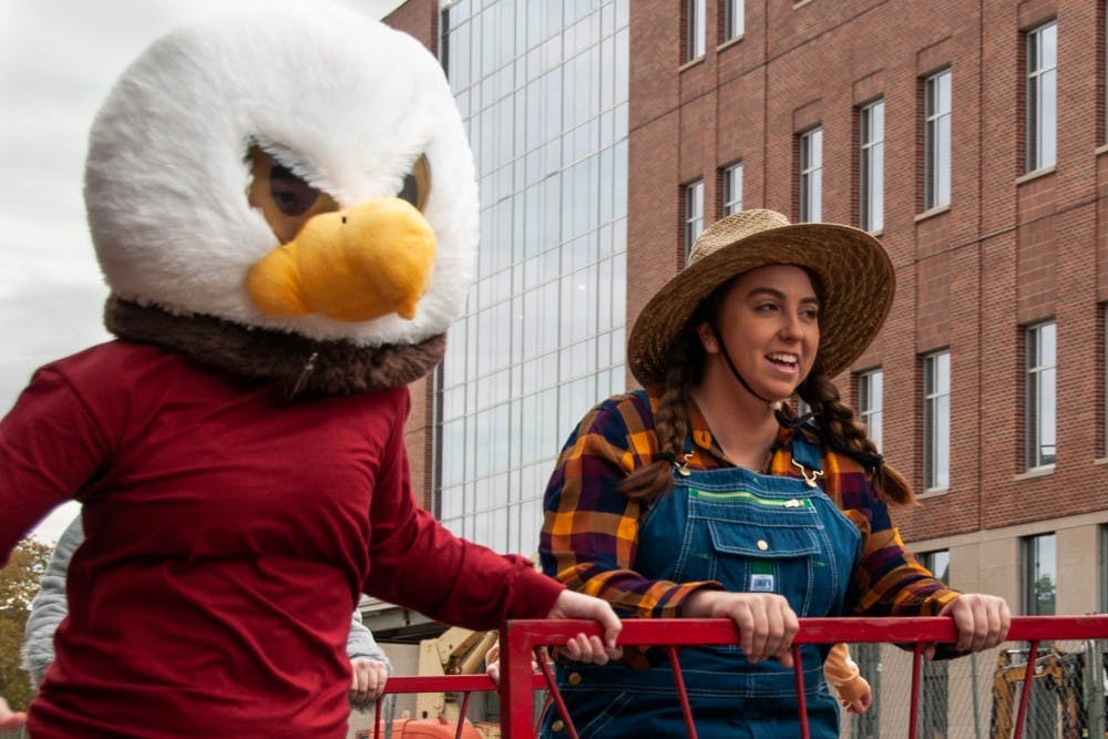 Students compete in Bed Races, the annual Homecoming event Oct. 19, 2018, on Riverside Ave. The entire block of Riverside is shut down during this hour every Homecoming weekend. Madeline Grosh,DN