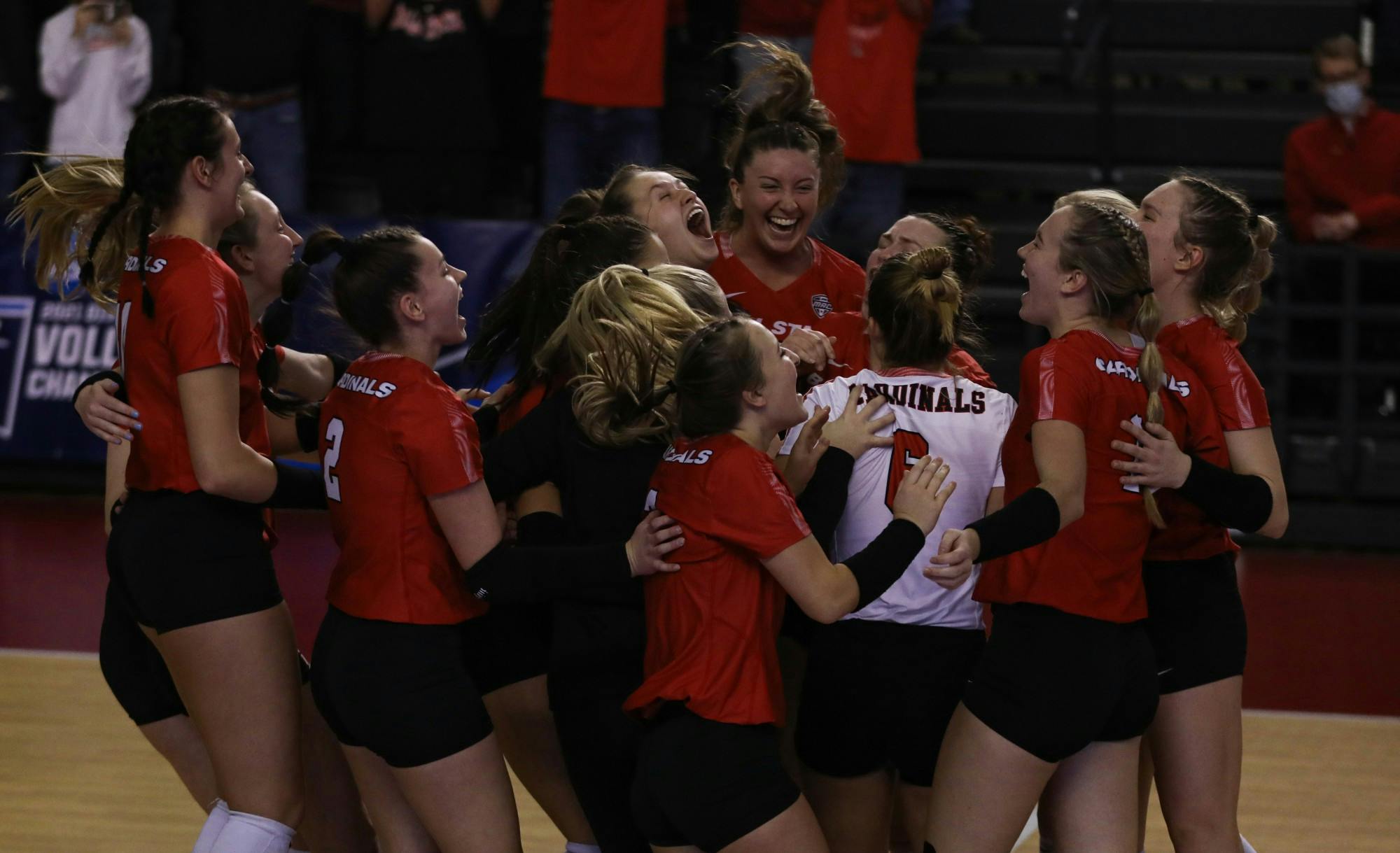 Ball State women's volleyball celebrates its first NCAA tournament win in 26 years against the University of Michigan at L & N Federal Credit Union Arena Dec. 3. Ball State will face off against the University of Louisville Dec. 4 in the second round of the tournament. Jacy Bradley, DN