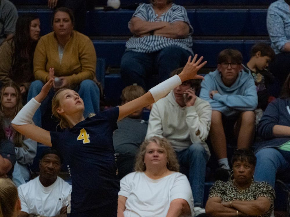 Junior outside hitter, Baylee Rich, jumps for an attack on a ball against Brebeuf on Sept. 3. Brebeuf would take the match in three straight sets.