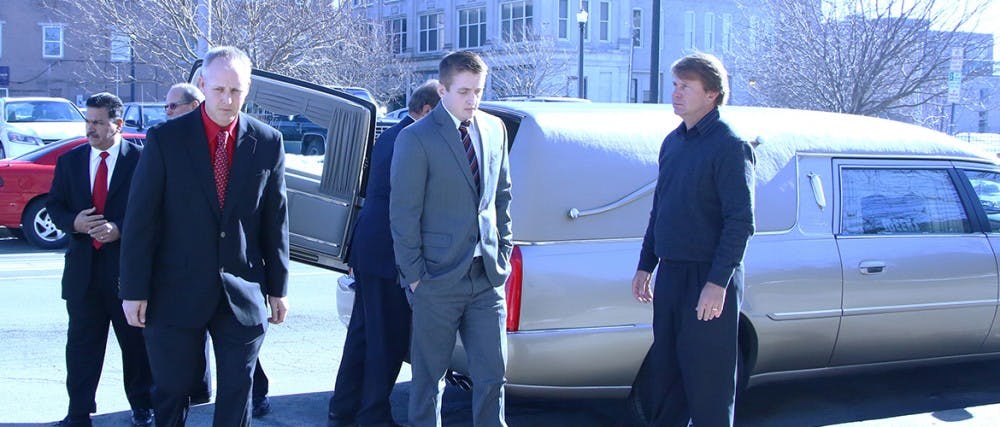 Pallbearers take Earl Yestingsmeier