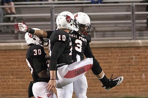 Junior wide receiver Willie Snead and Senior quarterback Keith Wenning celebrates a touchdown during a regular season game in 2012. Snead and Wenning  have played off one another’s strengths in the two seasons they have worked together. DN FILE PHOTO BOBBY ELLIS