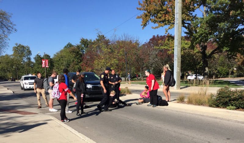 A pedestrian was struck by a car while crossing the street near the Applied Technology Building Oct. 20. The student was transported with minor, non-life threatening injuries. Brynn Mechem, DN Photo.&nbsp;