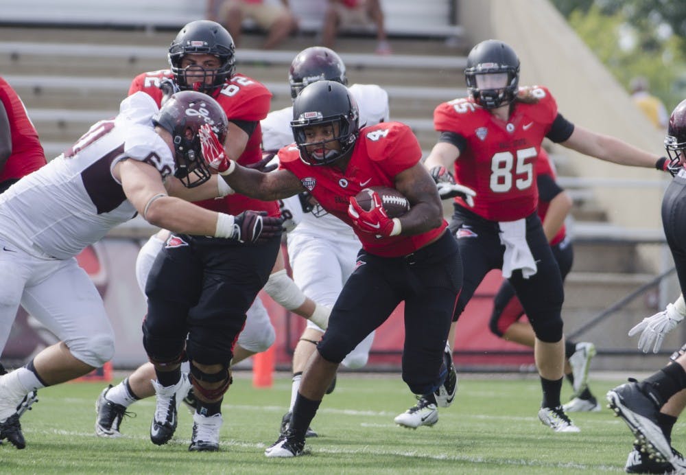 Junior running back Horactio Banks runs the ball down the field past a Colgate player Aug. 30 at Scheumann Stadium. Banks will play against a his high school friend, Reggie Spearman, when the Cardinals take on Iowa State Sept. 6. DN PHOTO BREANNA DAUGHERTY