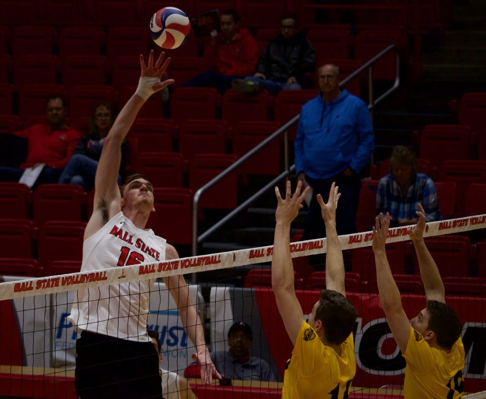 <p>Senior Matt Walsh hits the ball over the net during the second game at John E. Worthen Arena against Quincy University on March 31. The Cardinals defeated the Hawks in three games. <strong>Rebecca Slezak, DN</strong></p>