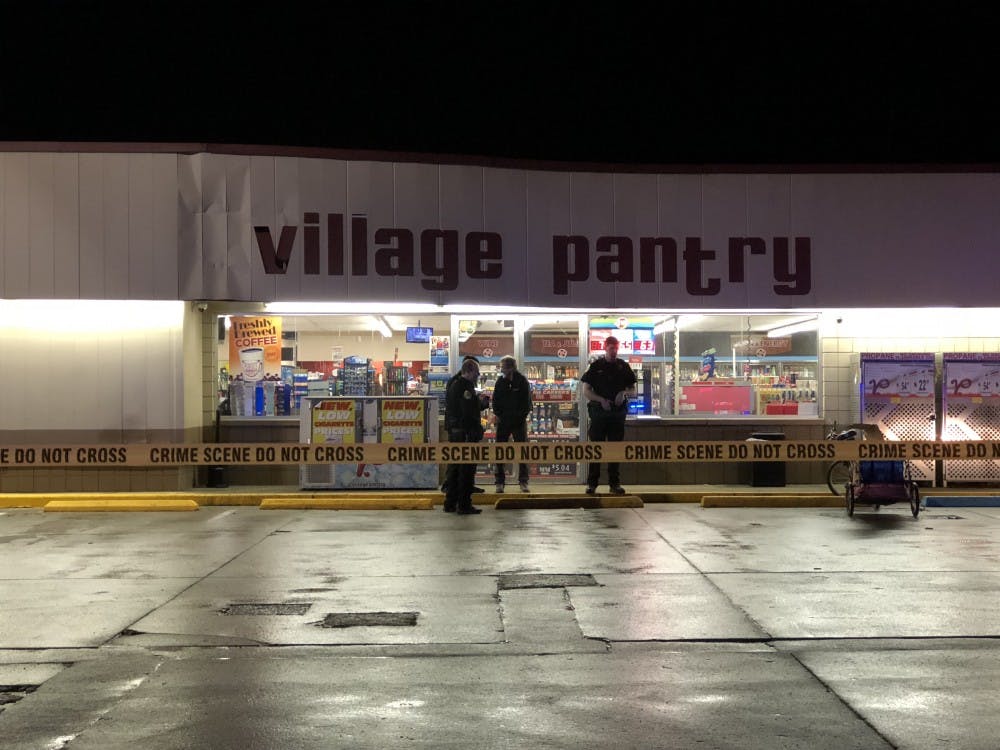 <p>Muncie police were called to the Village Pantry at the corner of East 18th Street and South Macedonia Avenue around midnight Tuesday on a shooting. The victim was transported to IU Health Ball Memorial Hospital. <strong>Andrew Smith, DN Photo</strong></p>