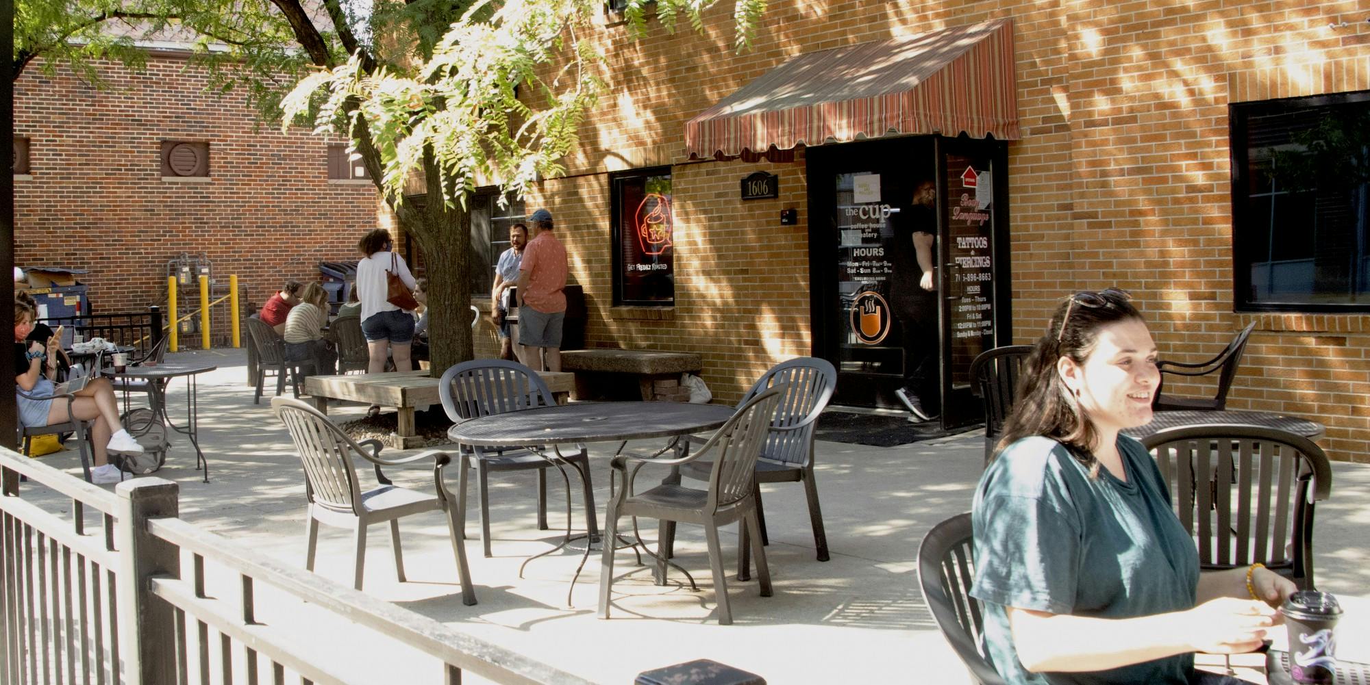 Customers hang around The Cup Sept. 6, 2020, in The Village. As businesses start to reopen, more and more people are going out in areas that were popular before the pandemic. Mary Stempky, DN