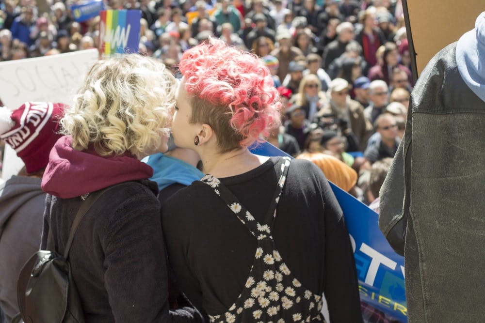 Two protesters on the Indiana Statehouse steps. | DN PHOTO BRADLEY DEAN JONES