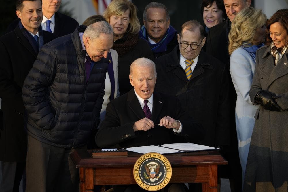 President Joe Biden signs the Respect for Marriage Act, Tuesday, Dec. 13, 2022, on the South Lawn of the White House in Washington. (AP Photo/Andrew Harnik)