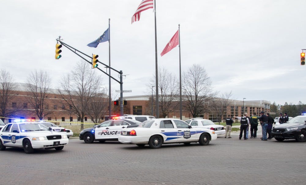 Police cars surround the Student Recreation and Wellness Center after the report of an armed assailant Nov. 15. DN PHOTO TAYLOR IRBY