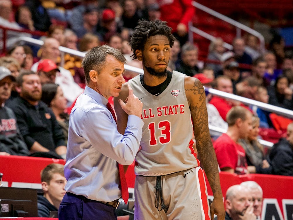 Head coach James Whitford talks with redshirt freshman guard/forward, Kani Acree (13), before entering the game late in the second half against Loyola Chicago Dec. 3, 2019, at John E. Worthen Arena. Acree played eight crucial minutes. Omari Smith, DN