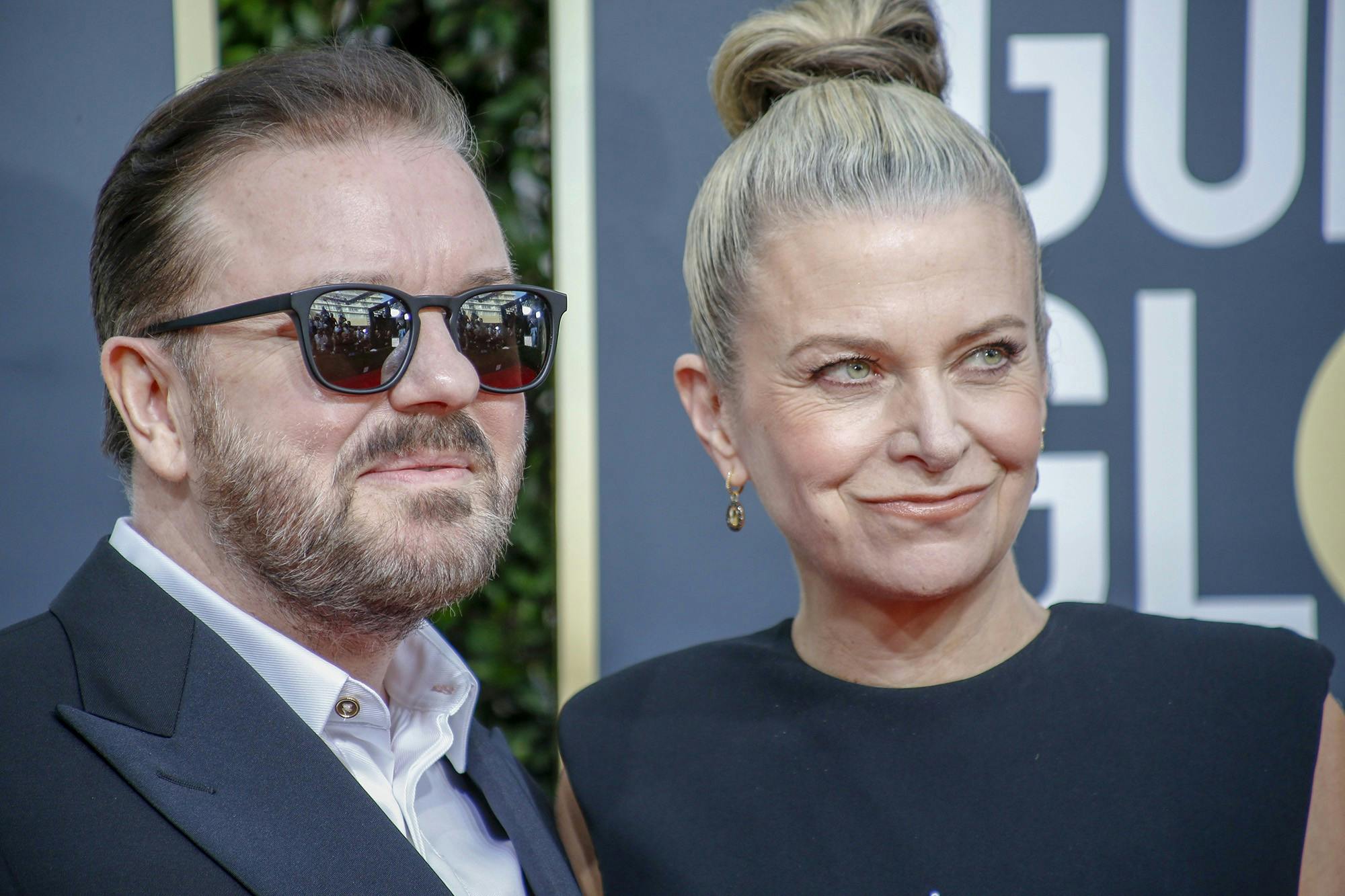 Ricky Gervais and Jane Fallon arrive at the 77th Golden Globe Awards at the Beverly Hilton in Beverly Hills, Calif., on Sunday, Jan. 5, 2020. (Marcus Yam/Los Angeles Times/TNS)