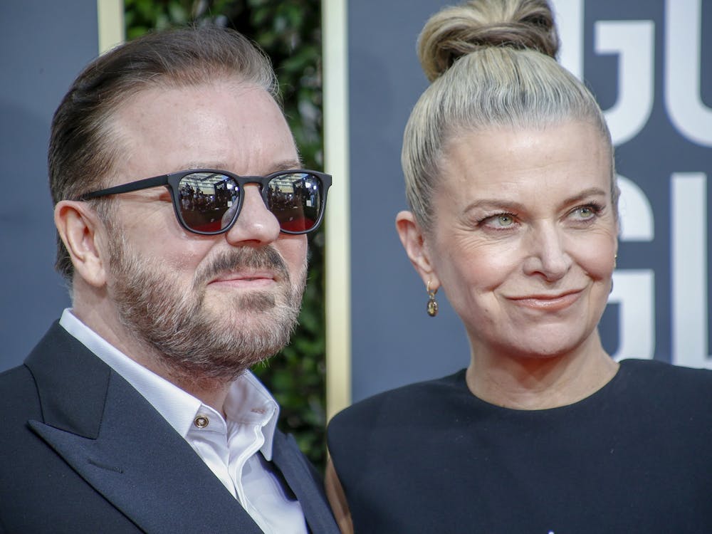 Ricky Gervais and Jane Fallon arrive at the 77th Golden Globe Awards at the Beverly Hilton in Beverly Hills, Calif., on Sunday, Jan. 5, 2020. (Marcus Yam/Los Angeles Times/TNS)