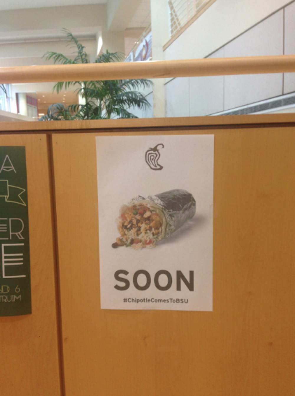 <p>Chipotle does not have any plans to come to Muncie in the near future. There is a sign in the Atrium staircase with a photo of a Chipotle burrito saying, "Soon" and the hashtag #ChipotleComesToBSU. <em>DN PHOTO BREANNA DAUGHERTY</em></p>