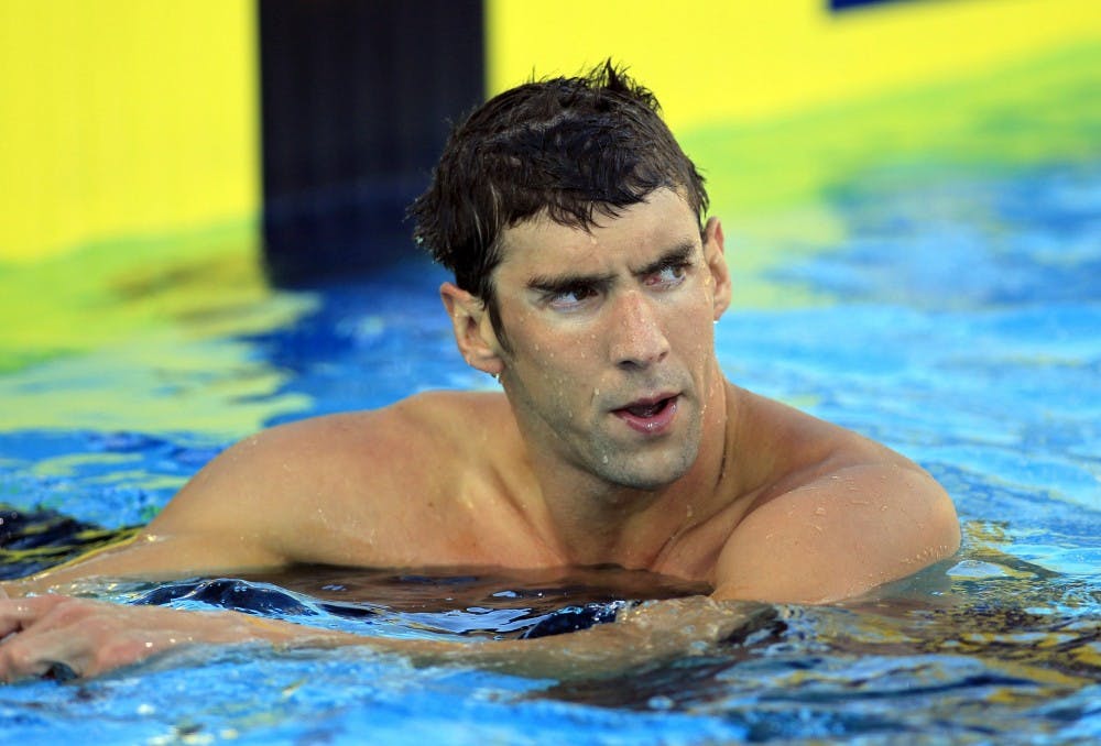 Olympic champion swimmer Michael Phelps looks with disappointment at the clock after taking 7th place in the men's 100m freestyle at the Phillips 66 USA Swimming National Championships at William Woollett Jr. Aquatics Center in Irvine, Calif., on Wednesday, Aug. 6, 2014. (Allen J. Schaben/Los Angeles Times/MCT)
