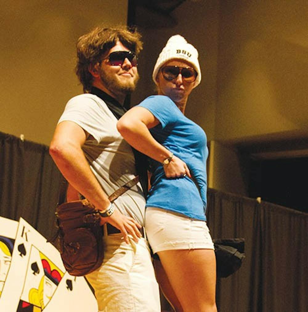 Patrick Crouch, left, and Kathryn Brewer, right, dresses up as Allen and Baby from the movie The Hangover during the Homecoming Fashion Show held Monday evening in Pruis Hall. DN PHOTO EMMA FLYNN