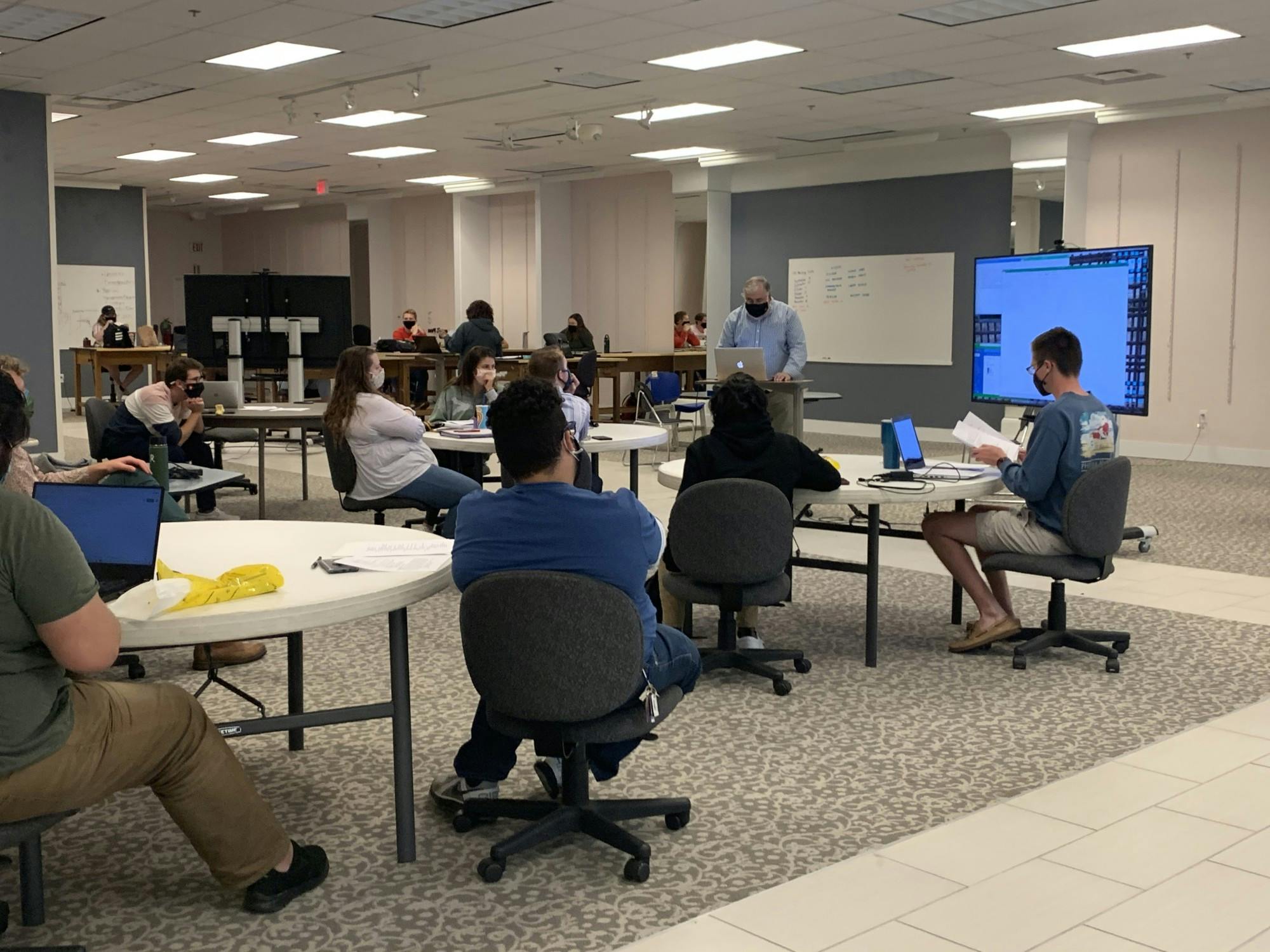 Students listen as Scott Truex, associate professor of urban planning, lectures on the statistics, architectural plans and historical documents about Muncie the class needs to gather. Students in the class are working alongside Muncie city and Delaware County on Muncie&#x27;s next comprehensive plan and Muncie Action Plan. Liz Rieth, DN