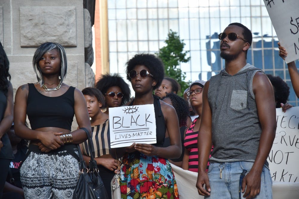 <p>After two shootings this past week in Louisiana and Minnesota by police officers, a Black Lives Matter protest throughout downtown Indianapolis on July 9 led around 600 people to the Indiana State House. <em>DN PHOTO PATRICK CALVERT</em></p>