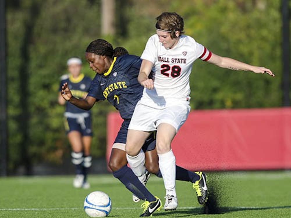 Senior midfielder Maimee Morris tries to keep possession of the ball during a drive as Kent State's Katherine Lawrence tries to steal. Ball State lost 1-0. DN PHOTO COREY OHLENKAMP
