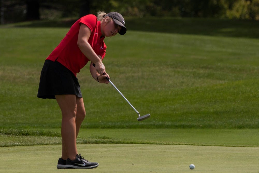 Sophmore Emily Knouff putts at the Players Club at Woodland Trails in Yorktown, Indiana Sept. 17, 2018 during the Cardinal Classic Golf Tournament. The Cardinals were one of 17 teams represented for the tournament. Eric Pritchett,DN