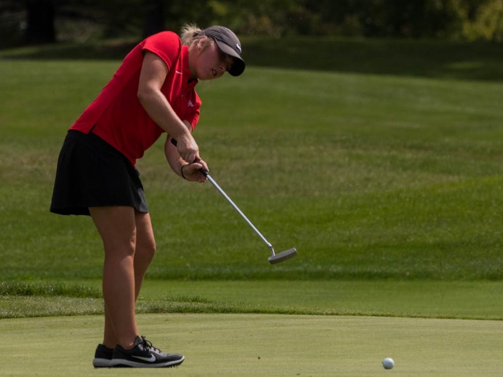 Sophmore Emily Knouff putts at the Players Club at Woodland Trails in Yorktown, Indiana Sept. 17, 2018 during the Cardinal Classic Golf Tournament. The Cardinals were one of 17 teams represented for the tournament. Eric Pritchett,DN