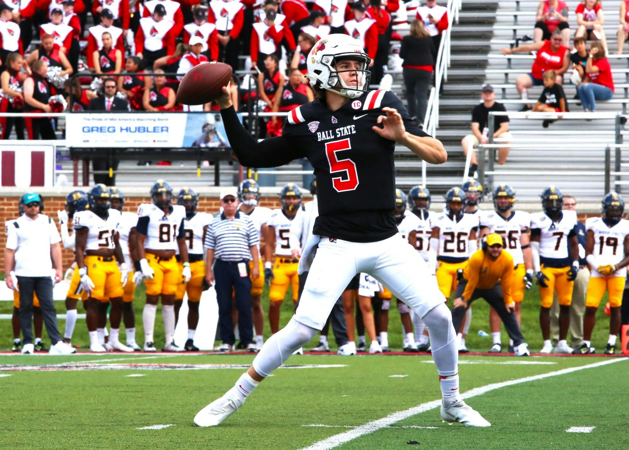 Junior quarterback John Paddock braces to throw the football at game against Murray State at Scheumann Stadium Sept. 17. Paddock had 3 touchdowns. Emma Matlock, DN