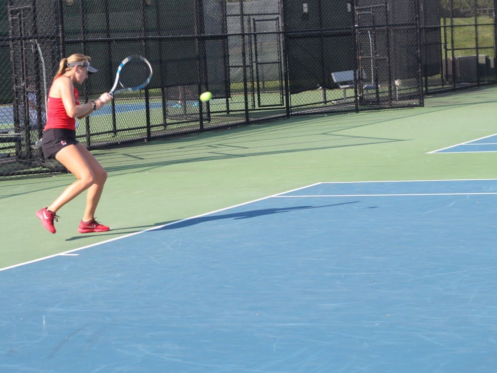 Senior Sarah Swiderski returns the ball to a Detroit Mercy player in a singles match during the Hidden Dual Tournament Sept. 22, 2018, at the Cardinal Creek Tennis Center. Swiderski went 1-1 in her singles matches. Patrick Murphy, DN