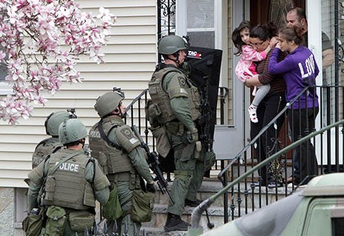 Police clear a house in a search for a suspect in the Boston Marathon bombings in Watertown, Massachusetts, on Friday, April 19, 2013. MCT PHOTO