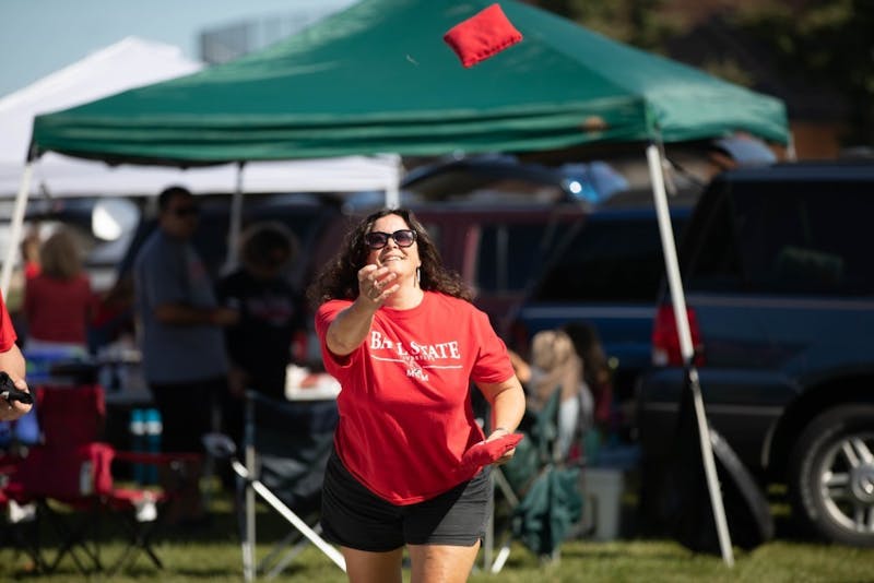 A Ball State mom plays cornhole at the tailgate on Sept. 14, 2019, outside Scheumann Stadium. Charlie Town, located near the Alumni Center, is one tailgating opportunity for families and visitors. Jacob Musselman, DN File