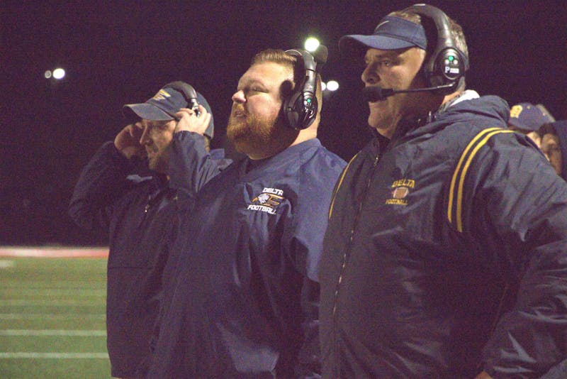 Delta head coach Chris Overholt and assistants watch a play Nov. 1 during a sectional game at Mississinewa High School. The game was Overholt's final contest as the Eagles' head coach. Zach Carter, DN. 