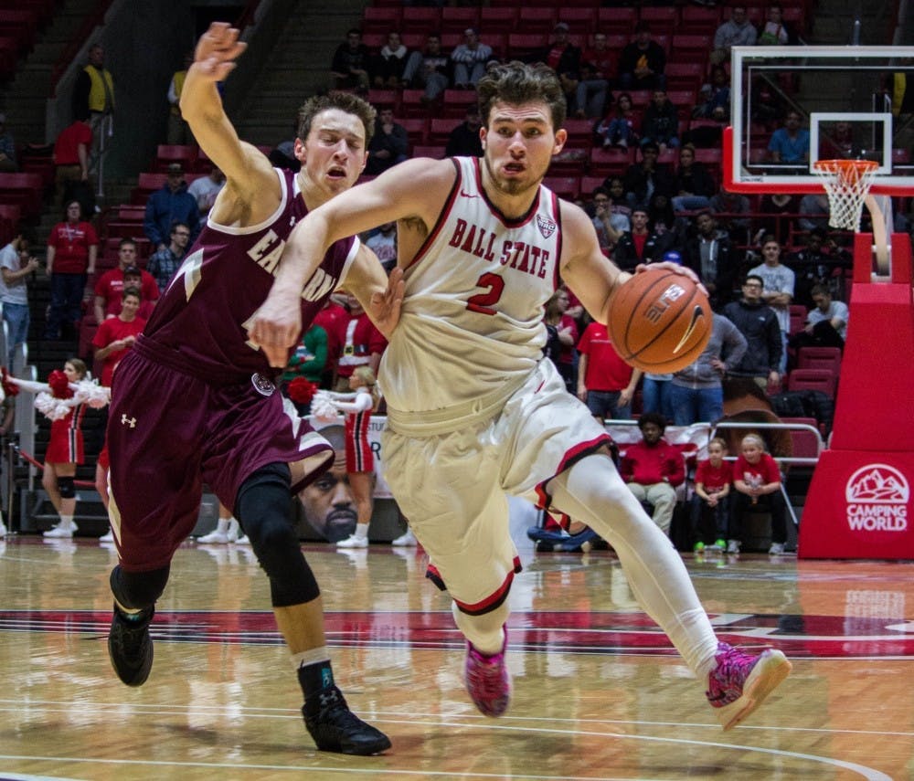Ball State guard Tayler Persons attempts to push past Eastern Kentucky  guard Dillon Avare during the game on Dec. 10 in Worthen Arena. The Cardinals are riding a two-game Mid-American Conference win streak as they head into their game against Central Michigan Jan. 17.&nbsp;Grace Ramey // DN File