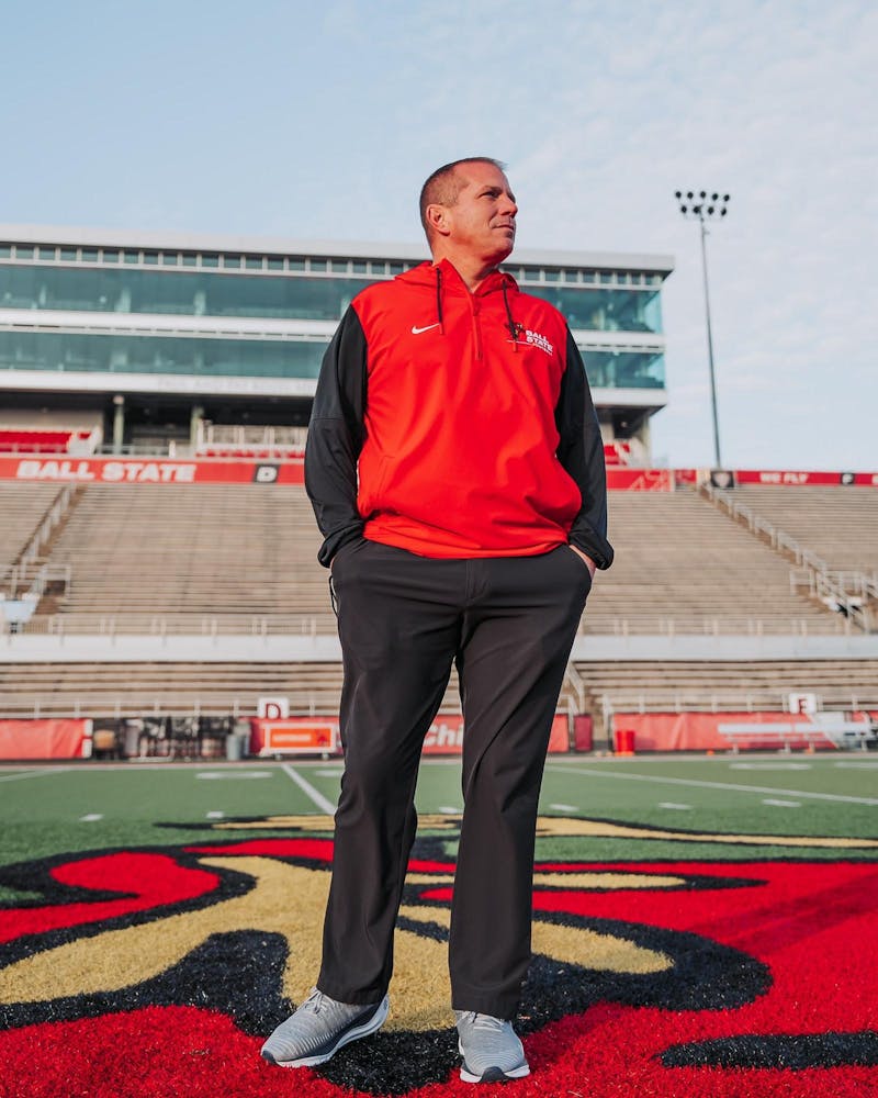 Head coach Mike Uremovich stands at center field at Scheumann Stadium. Ball State Athletics photo provided