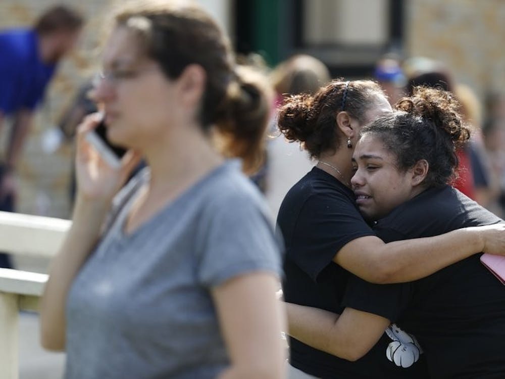 Santa Fe High School junior Guadalupe Sanchez, 16, cries in the arms of her mother, Elida Sanchez, after reuniting with her at a meeting point at a nearby Alamo Gym fitness center following a shooting at Santa Fe High School in Santa Fe, Texas, on Friday, May 18, 2018. AP Photo
