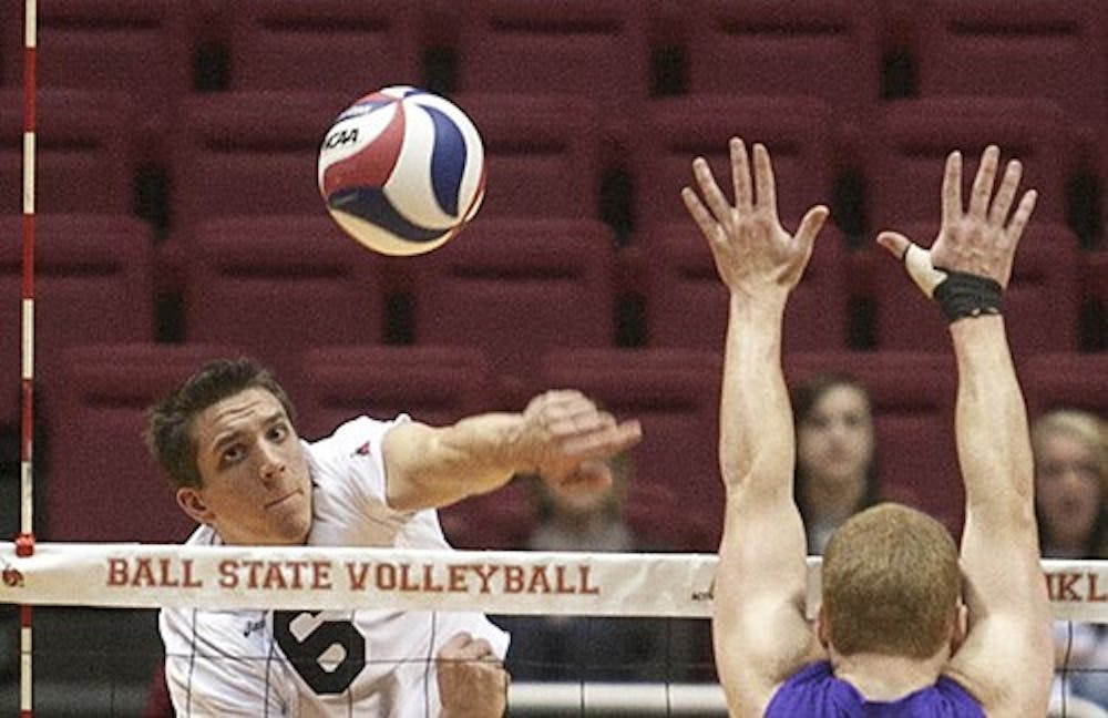 Senior Greg Herceg goes in for the kill during the game on Saturday afternoon. The Men's volleyball team won the match three sets to one verses Canyon. DN PHOTO JORDAN HUFFER