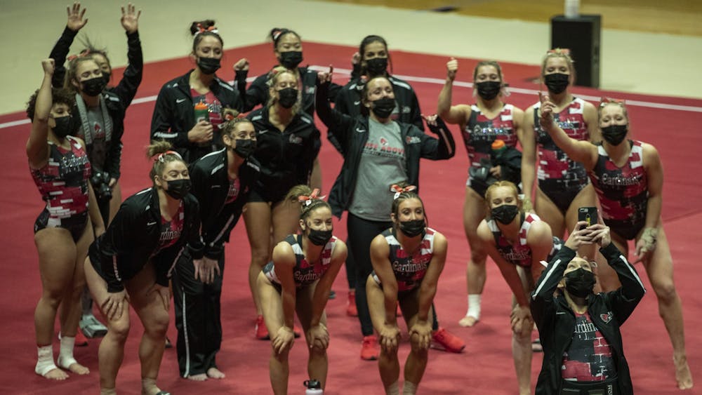 The Ball State Gymnastics team takes a team selfie before facing the Central Michigan Chippewas in their home-opener Jan. 24, 2021, at John E. Worthen Arena. The Cardinals beat the Chippewas 193.500-192.375. Jacob Musselman, DN