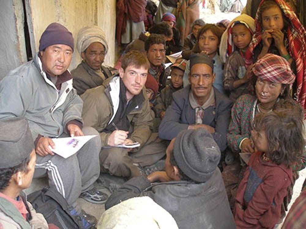 Conor Grennan, author of “Little Princes,” is seen with the family of one of the children that he rescued in a village in Nepal. PHOTOS PROVIDED BY CONOR GRENNAN