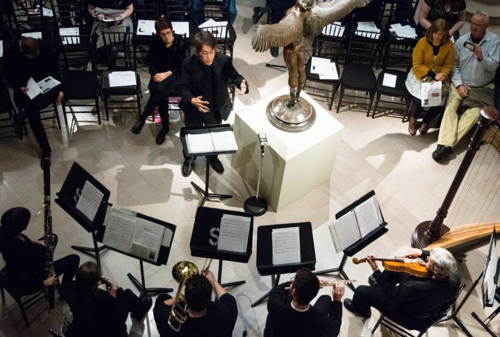 <p>Chin Ting Chan, musical director for The New Music Ensemble, conducts Nov. 1, 2017 at The David Owsley Museum for a performance. The School of Music played a concert with pieces inspired by artwork from the museum. <strong>Rachel Ellis, DN File</strong></p>